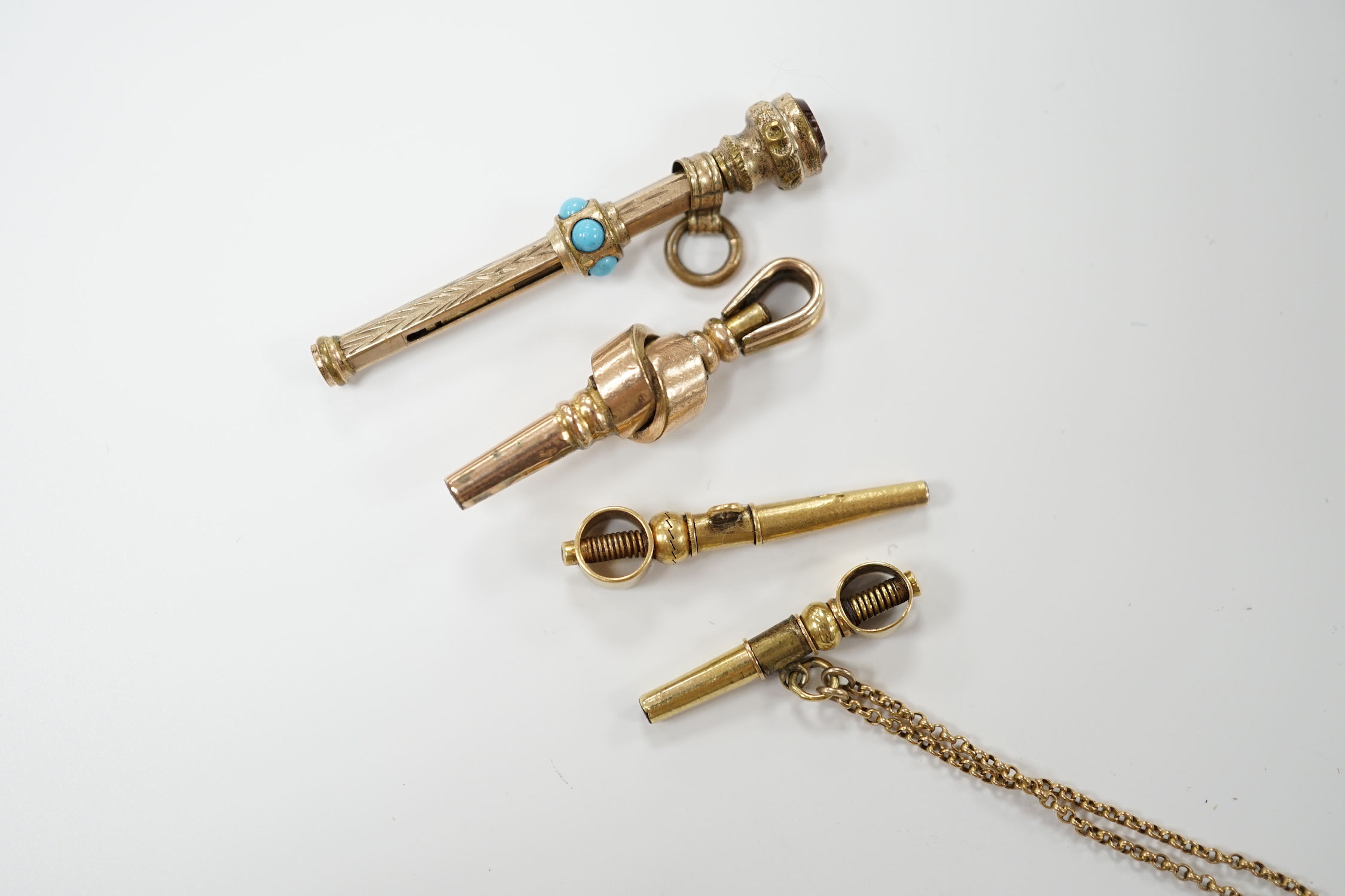 Three 19th century yellow metal overlaid watch keys and a similar propelling pencil, 40mm.